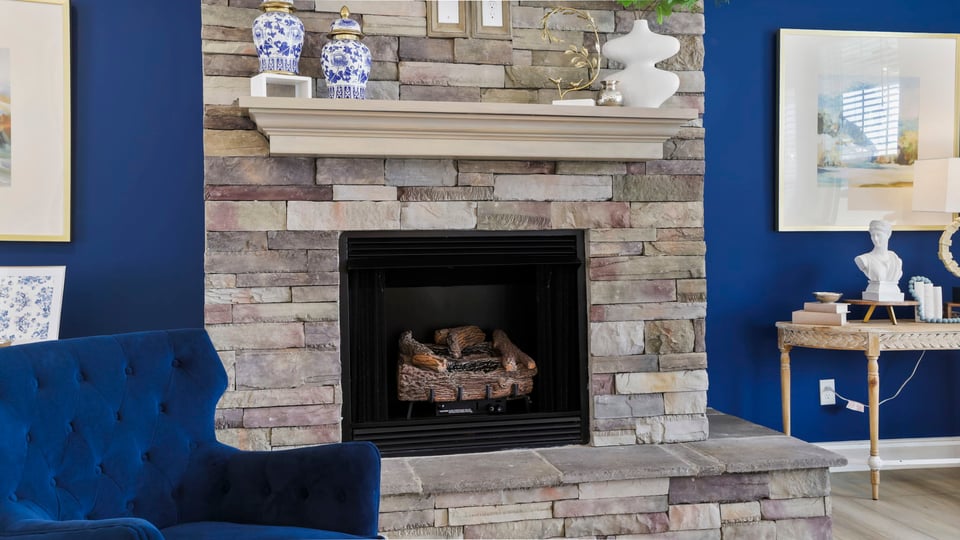 Livingroom with fireplace and windows.