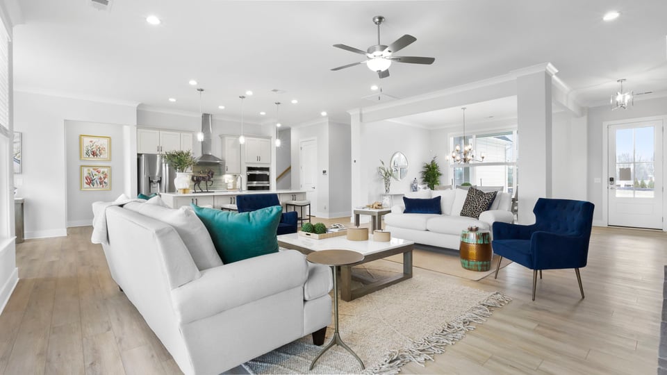 Livingroom with fireplace and windows.