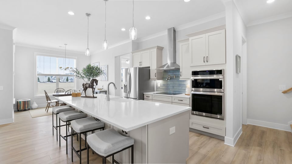Kitchen with island and cabinetry.