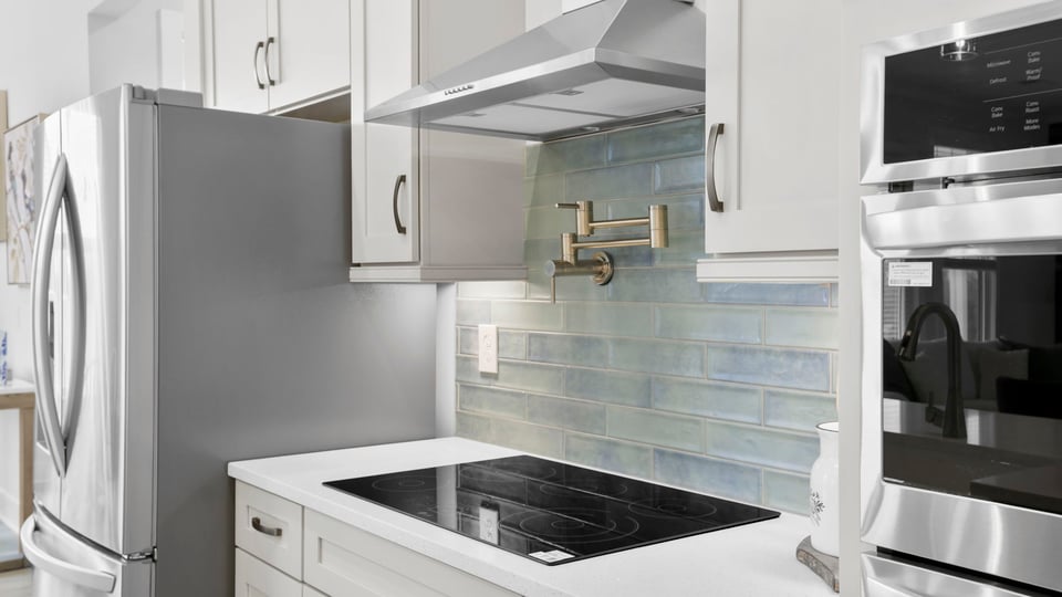 Kitchen with island and cabinetry.