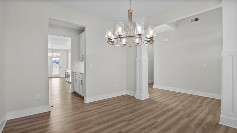 Bedroom with carpet and window.