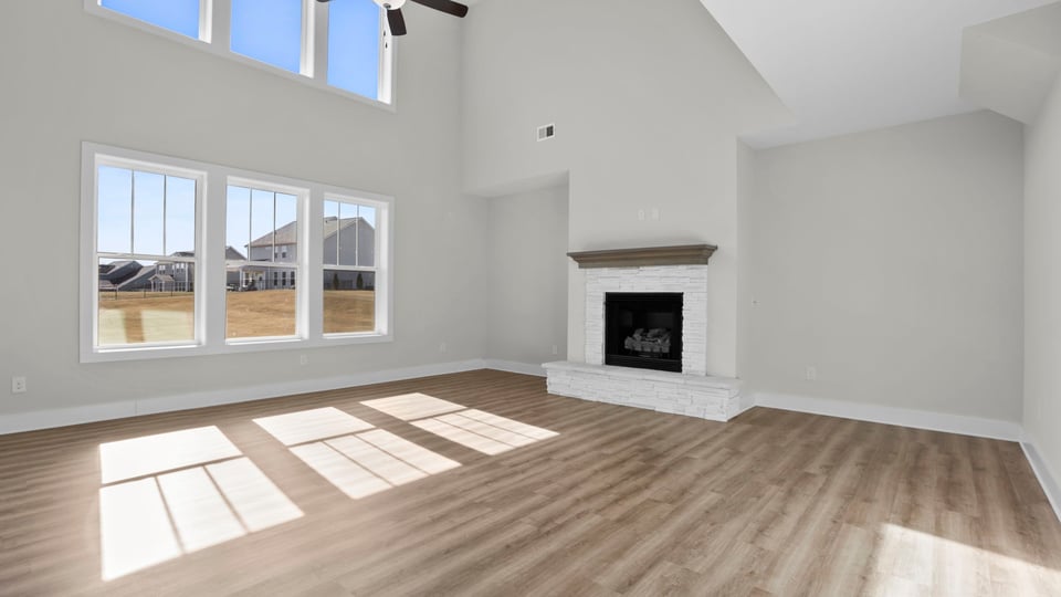 Bedroom with carpet and window.