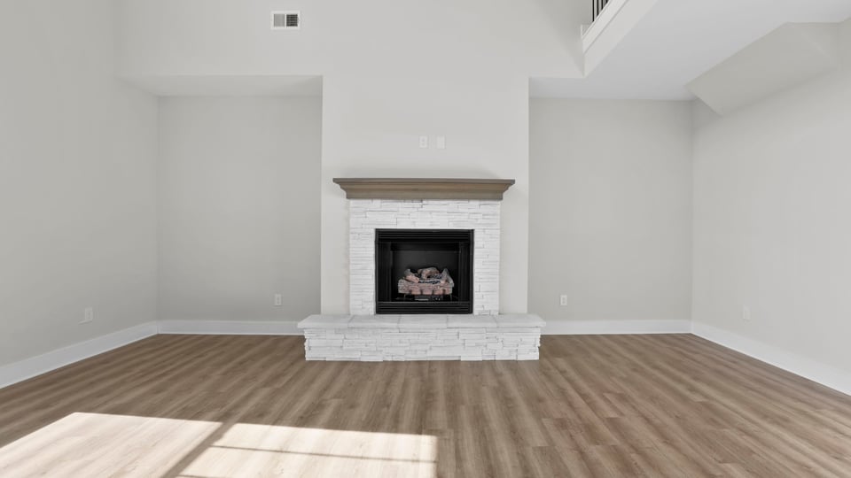 Bedroom with carpet and window.