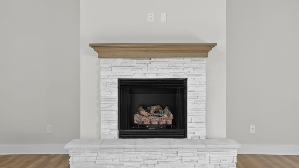 Bedroom with carpet and window.
