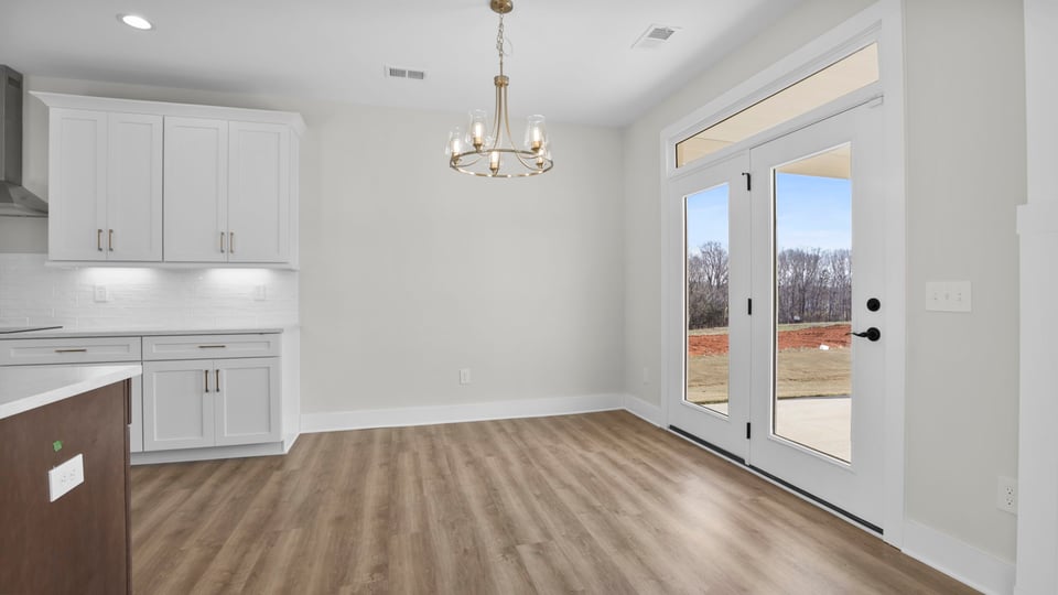 Kitchen and island with granite counter tops.