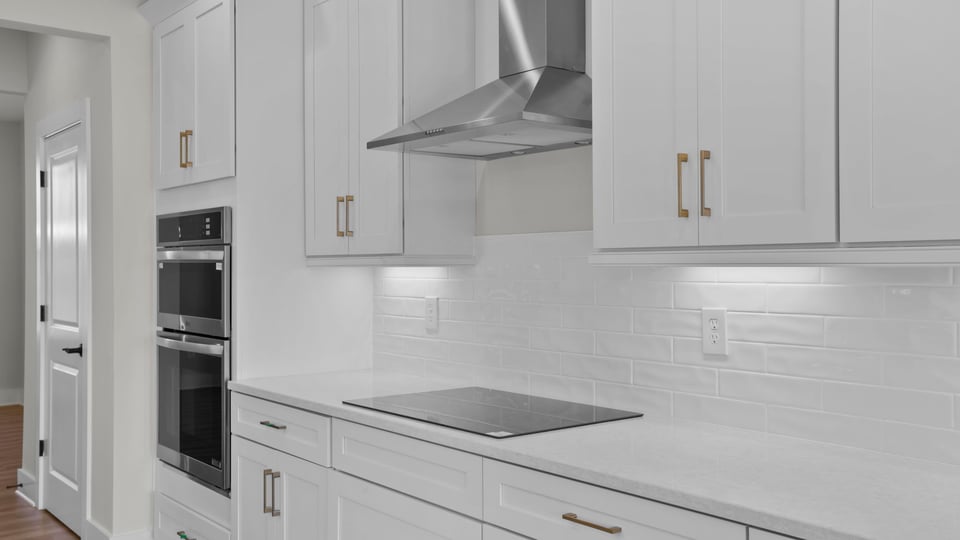 Kitchen and island with granite counter tops.