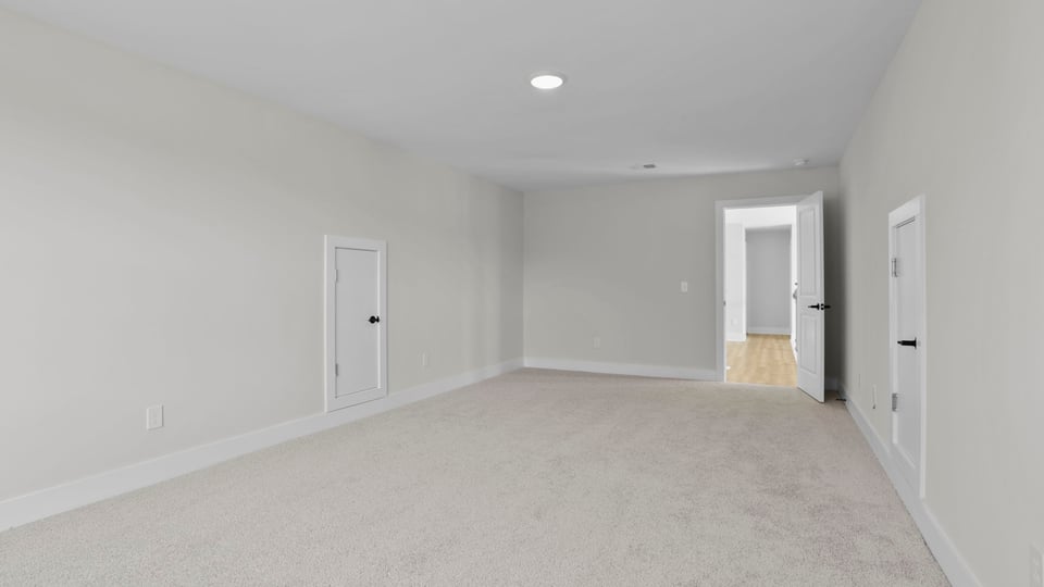 Bedroom with carpet and window.