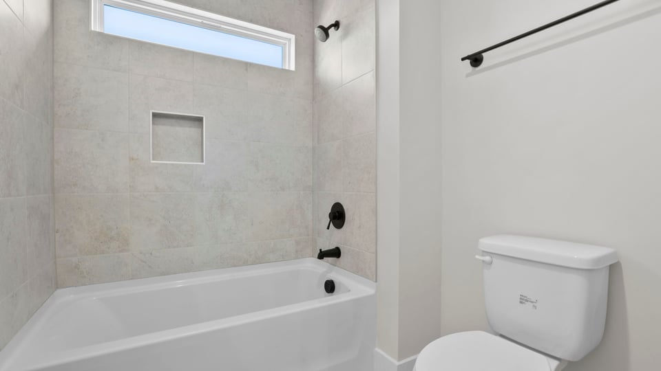 Bathroom with tub and toilet.