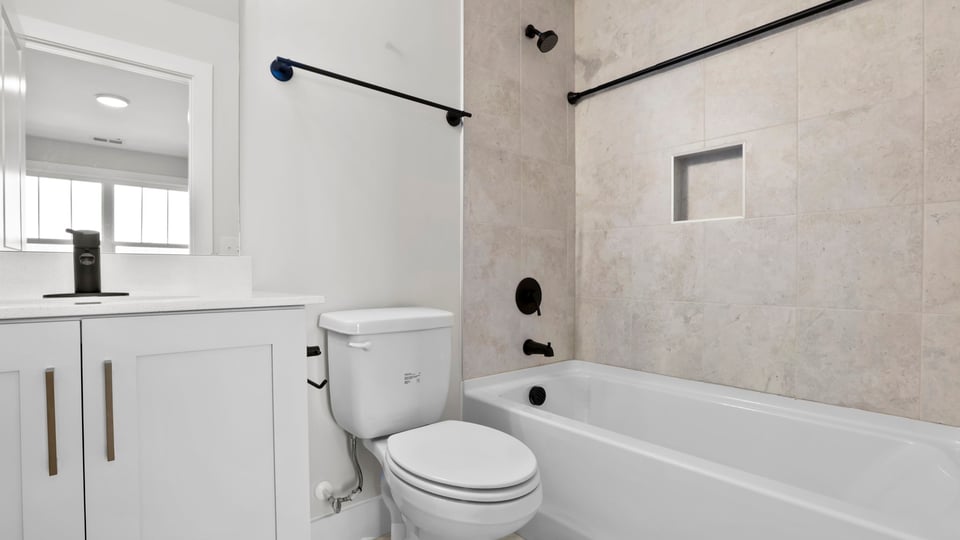 Bathroom with tub and toilet.