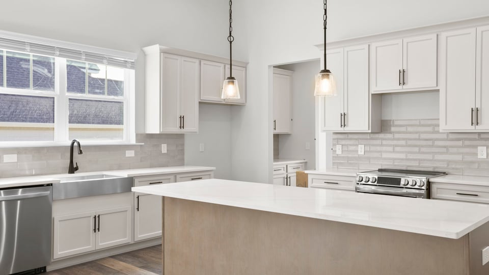 Kitchen and island with granite counter tops.