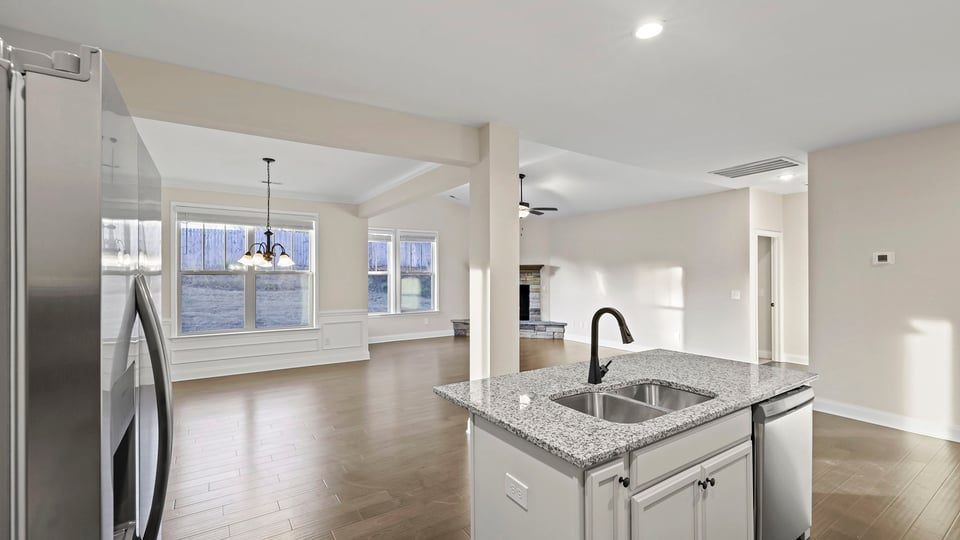 Kitchen and island with granite counter tops.