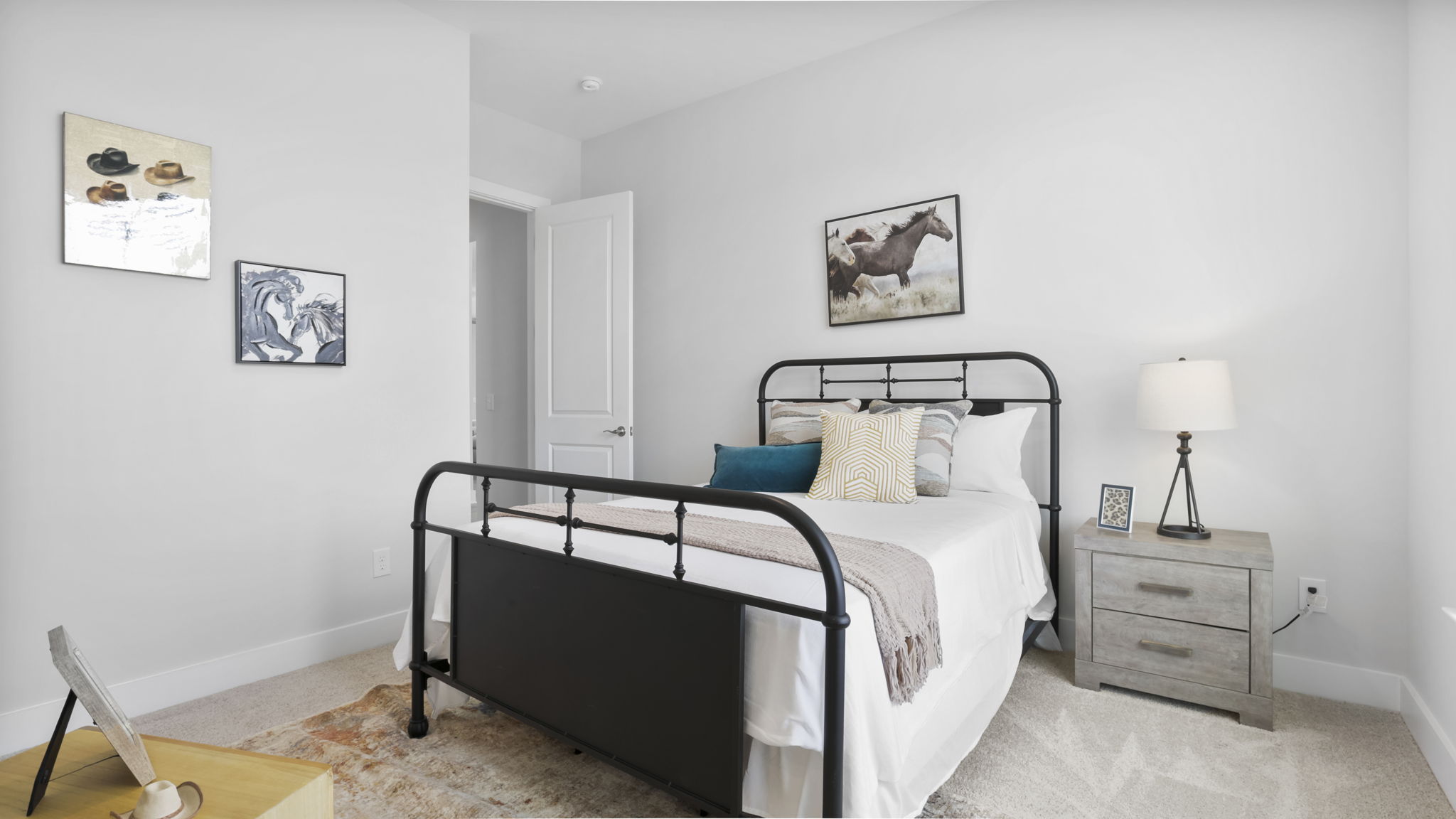 Bedroom with carpet and window.
