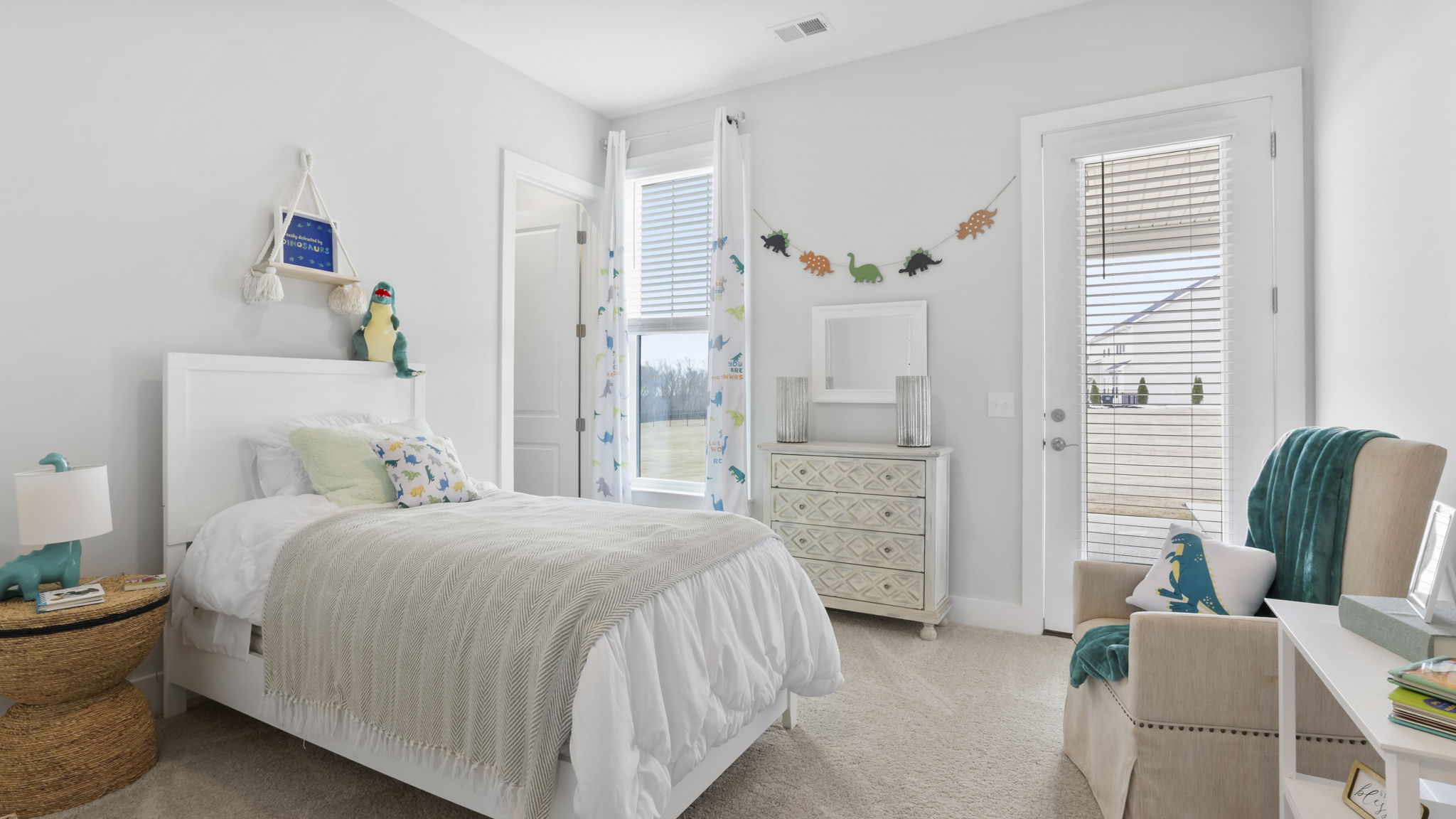 Bedroom with carpet and window.