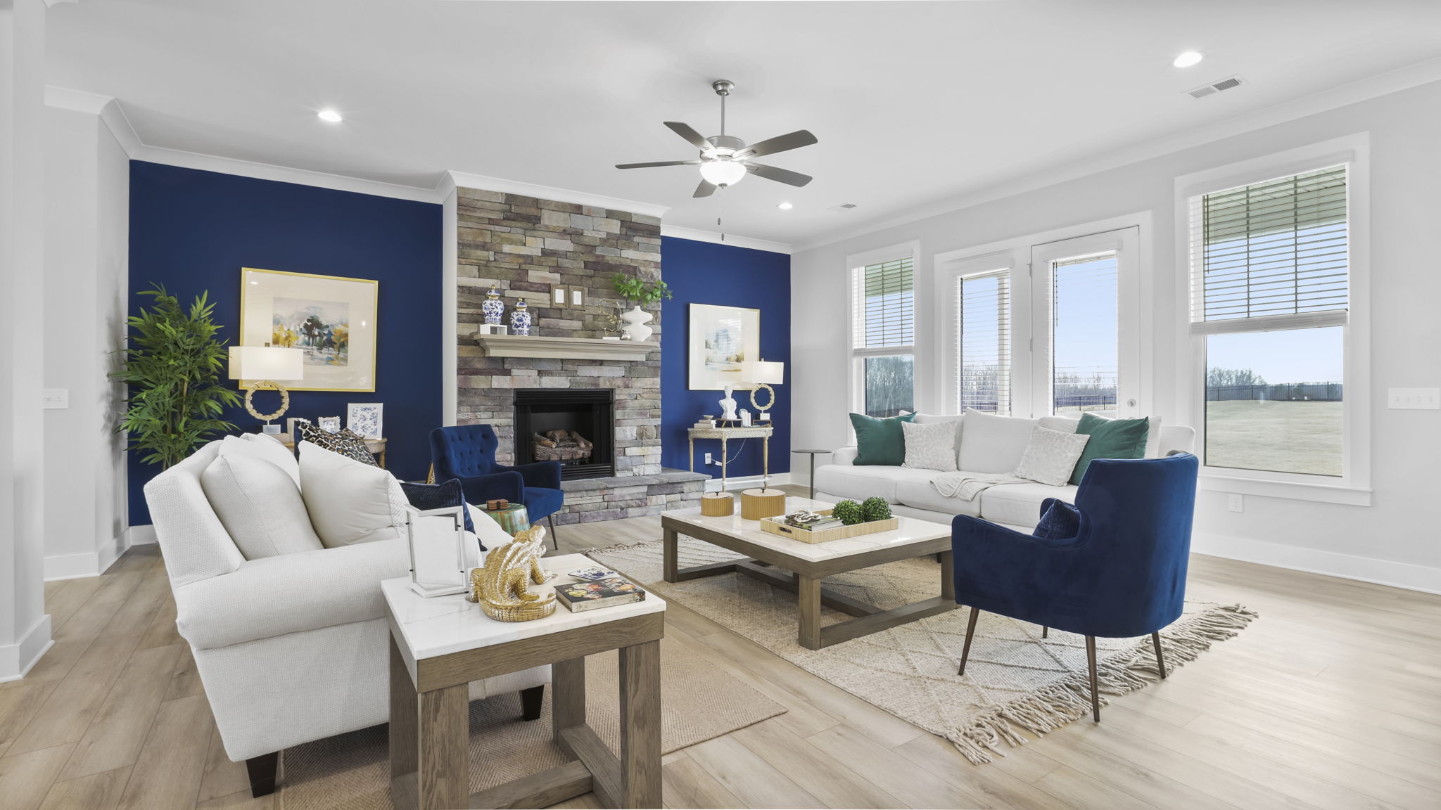 Family room with fireplace and windows.