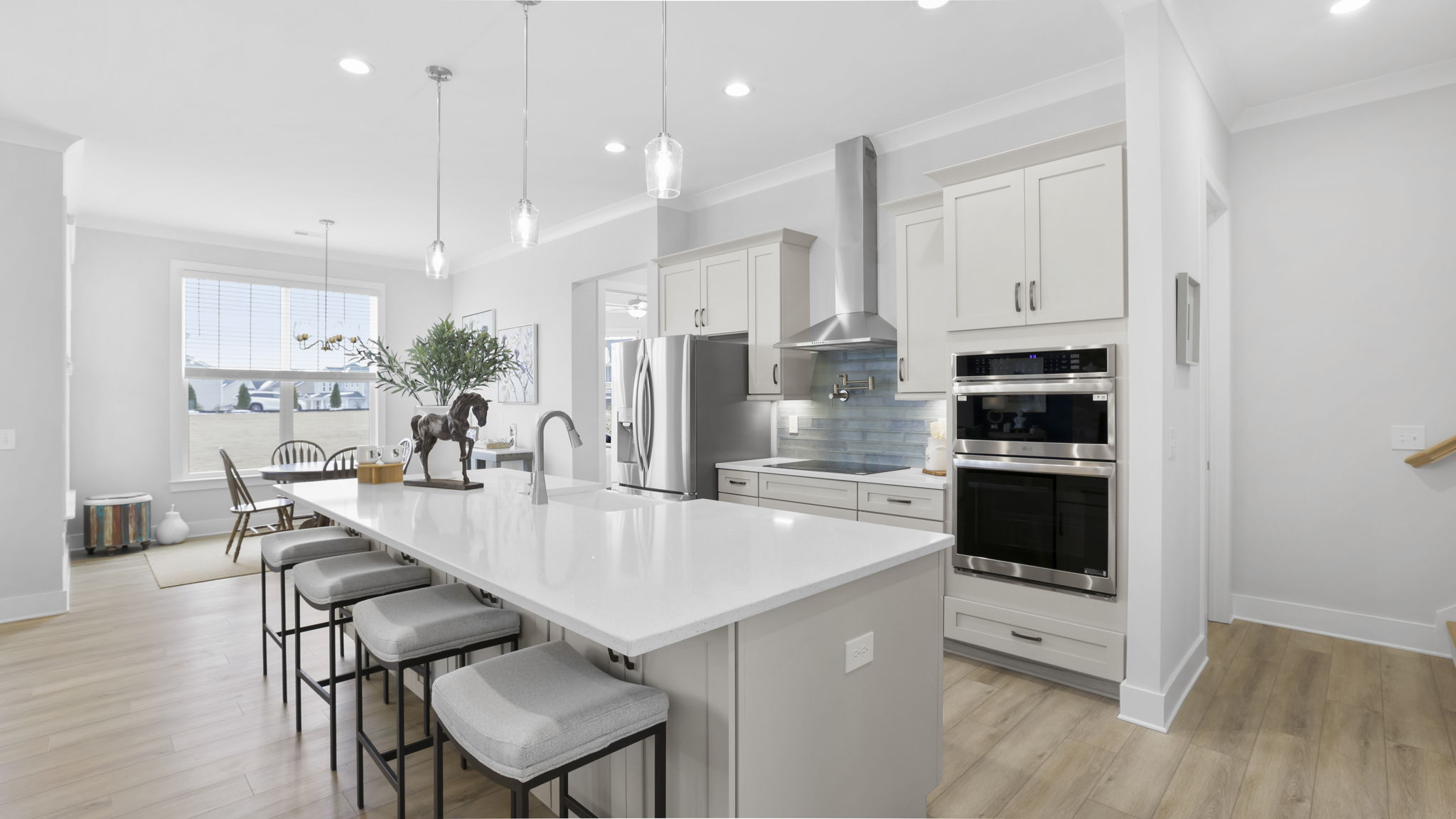 Kitchen and island with quartz countertops.