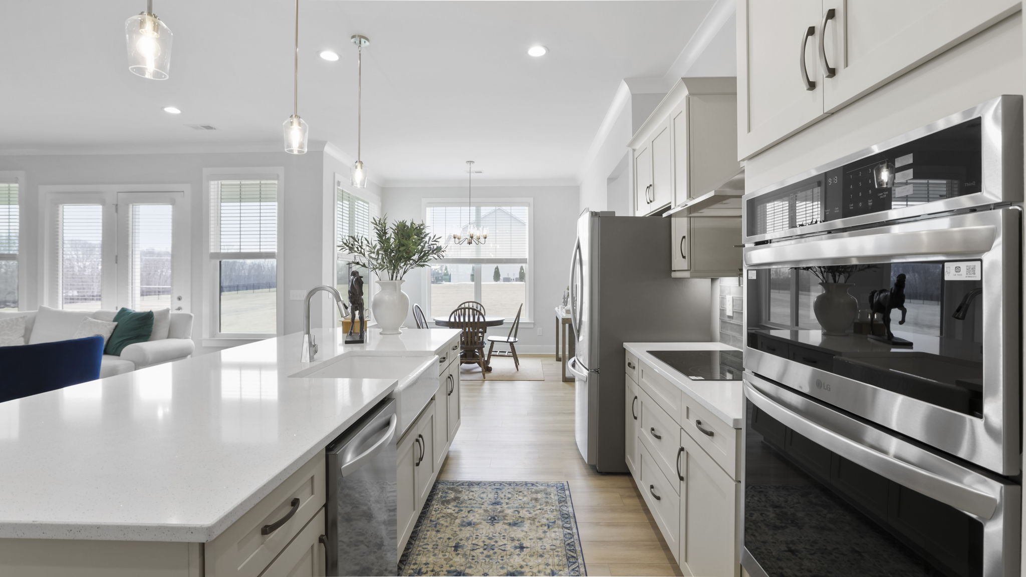 Kitchen and island with quartz countertops.