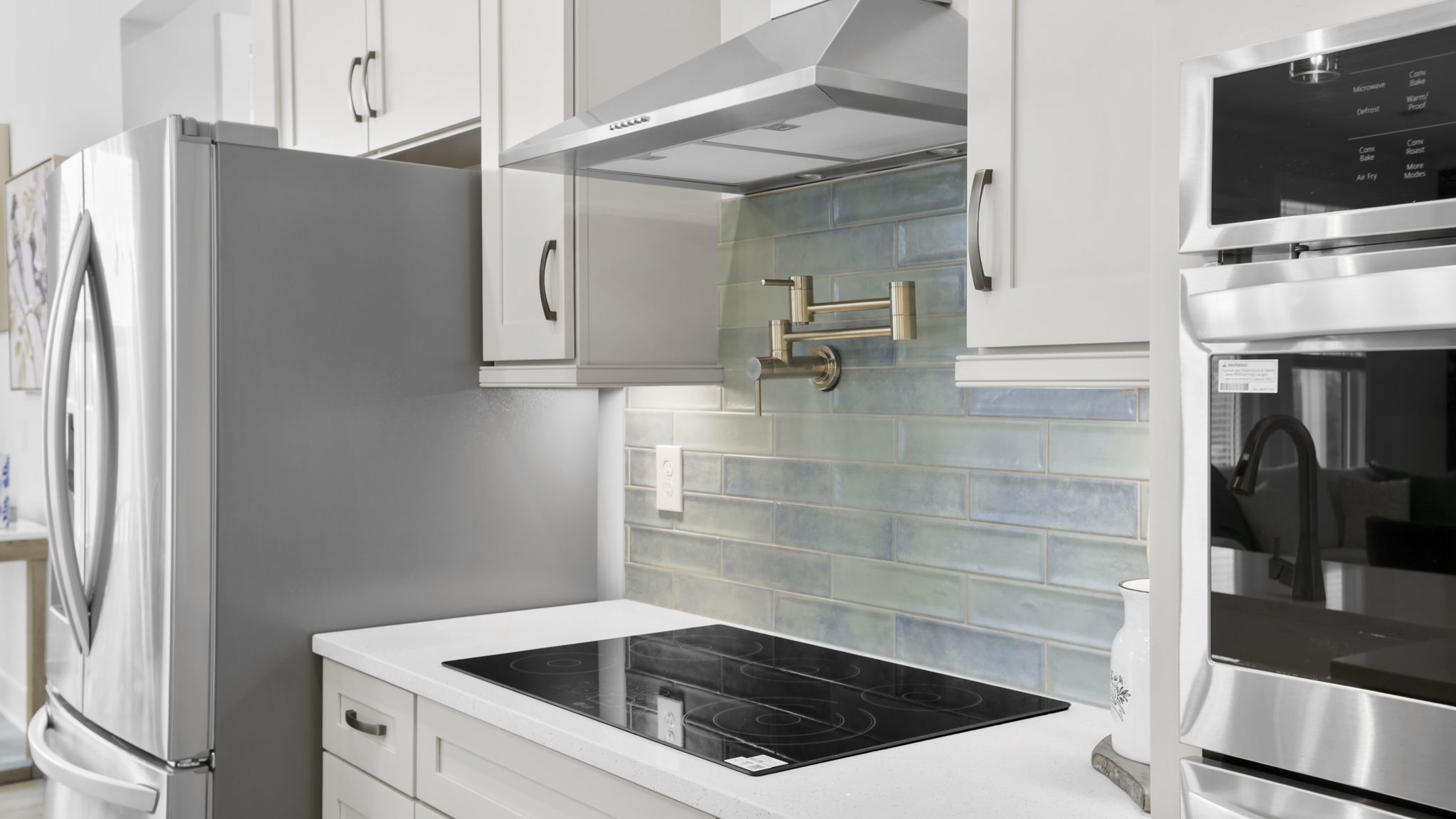 Kitchen with stainless steel appliances.