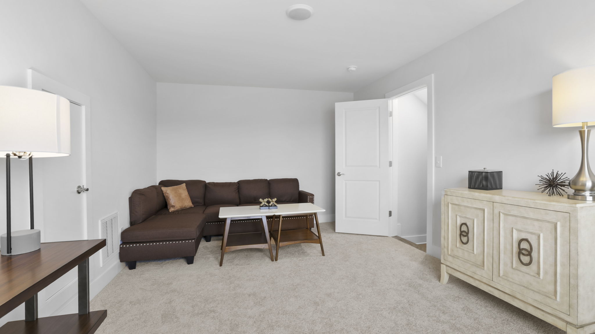 Bedroom with carpet and window.