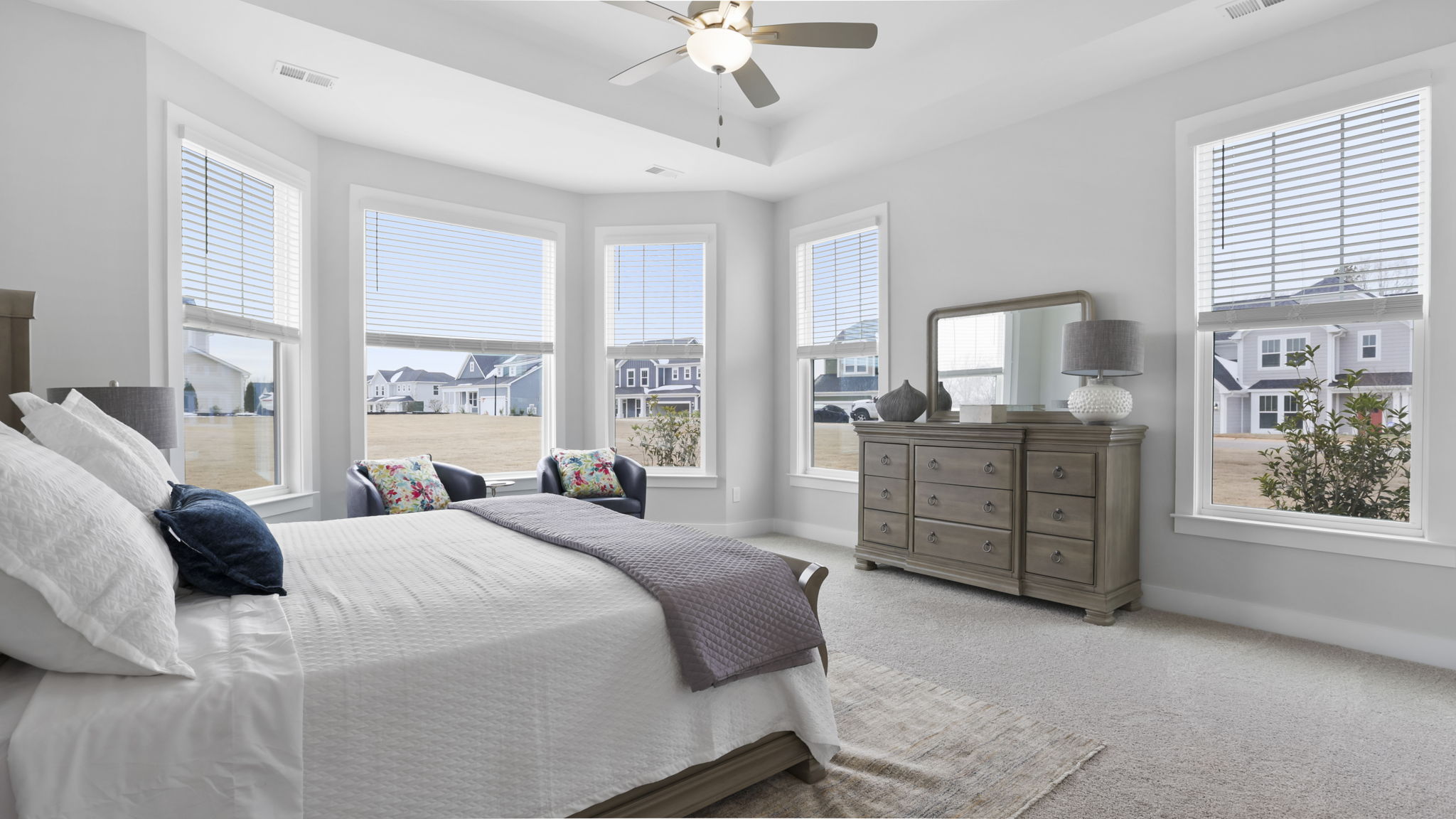 Bedroom with carpet and window.