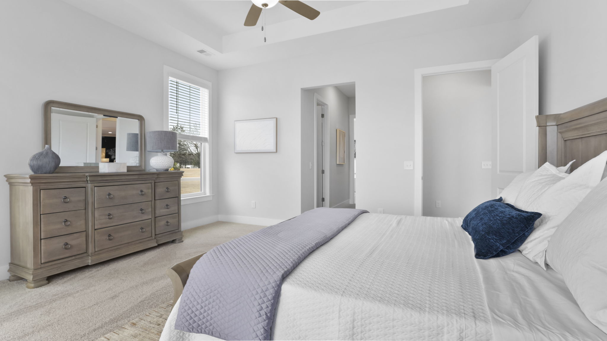 Bedroom with carpet and window.