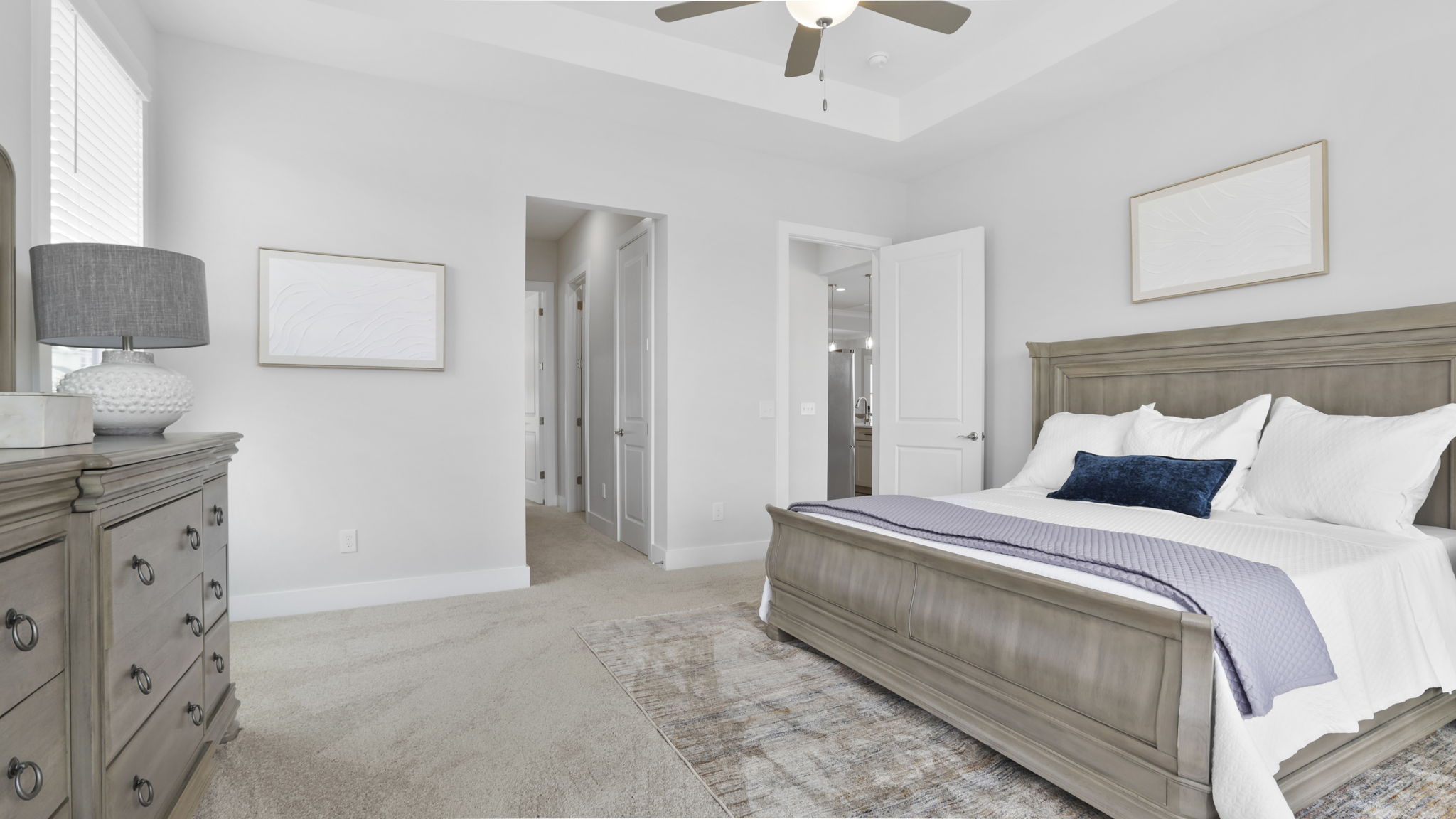 Bedroom with carpet and window.