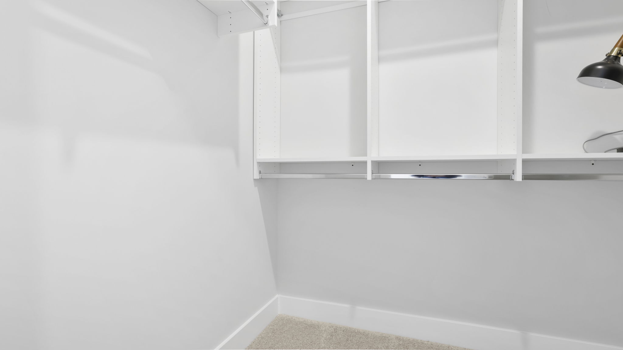 Laundry room with storage shelves.