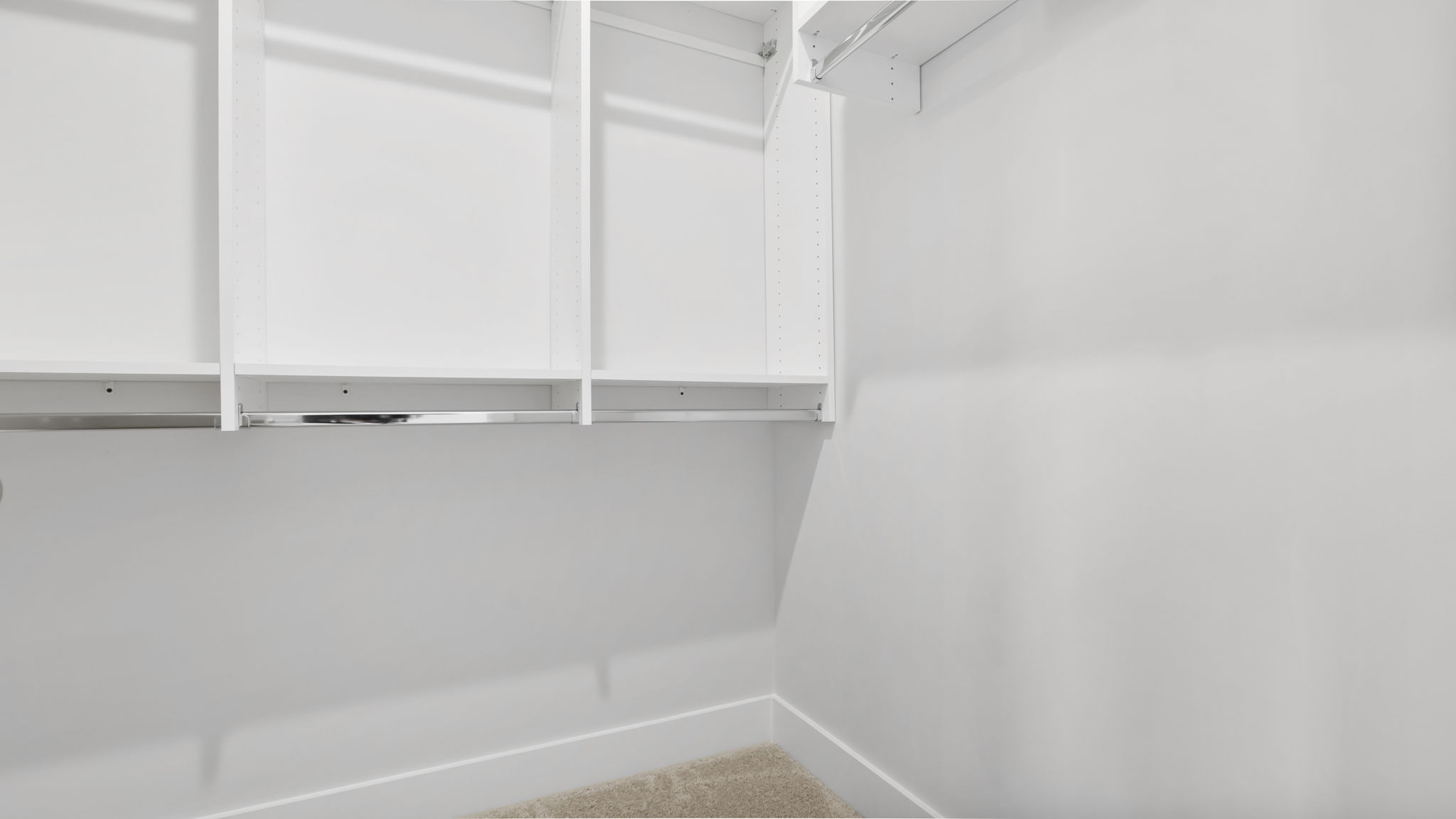 Laundry room with storage shelves.