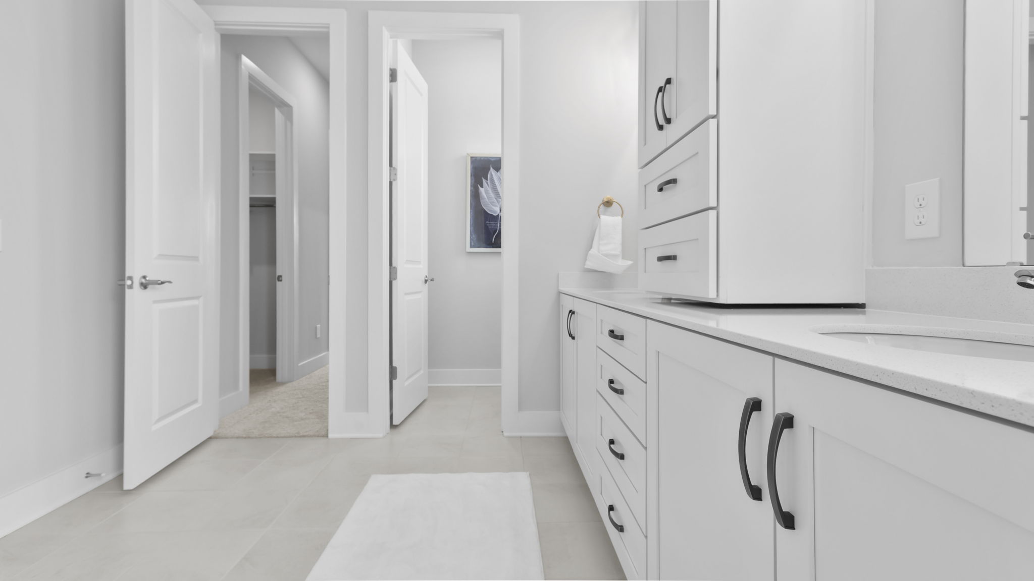 Bathroom with double vanity sink and walk in shower.