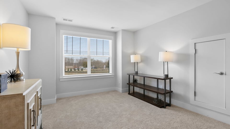 Upstairs loft area with carpet.