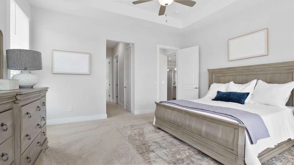 Bedroom with window and carpet.