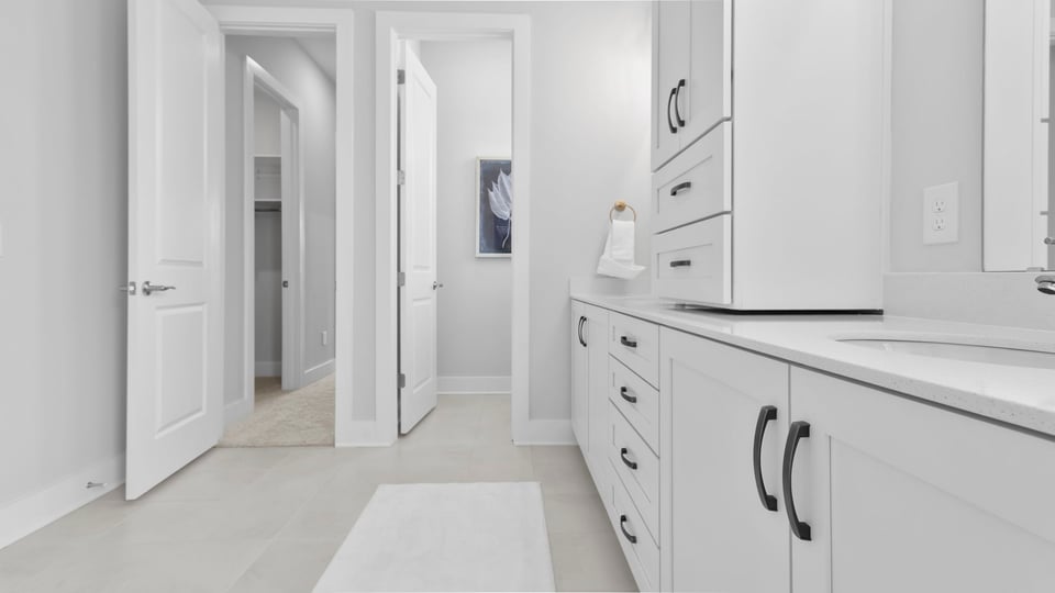 Bathroom with vanity and walk in shower.