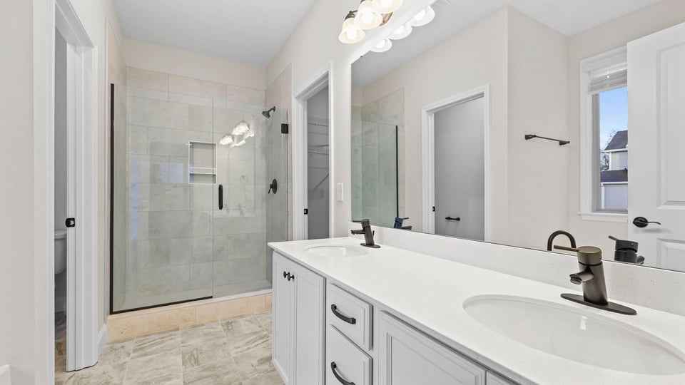 Bathroom with tub, vanity and walk in shower.