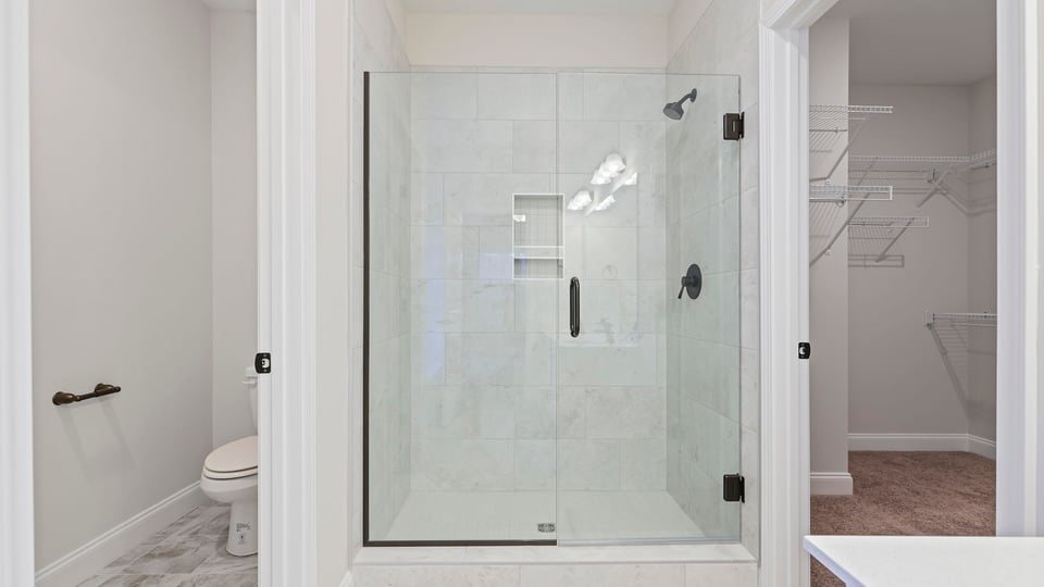 Bathroom with tub, vanity and walk in shower.