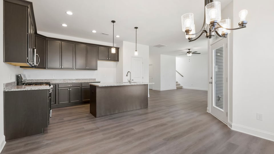 Kitchen with island and cabinets.