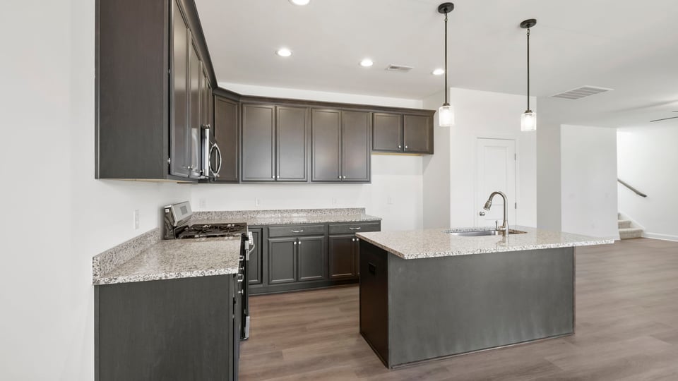 Kitchen with island and cabinets.