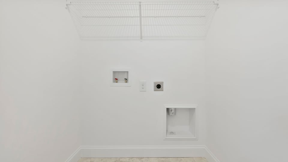 Laundry room with shelf.