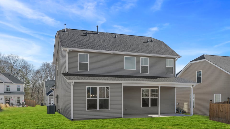 Back exterior with large backyard.