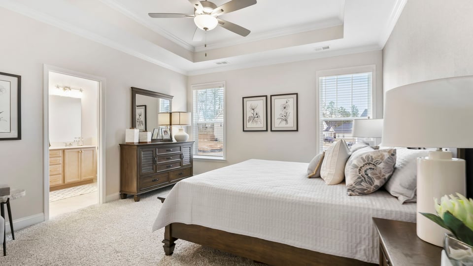 Bedroom with carpet and window.