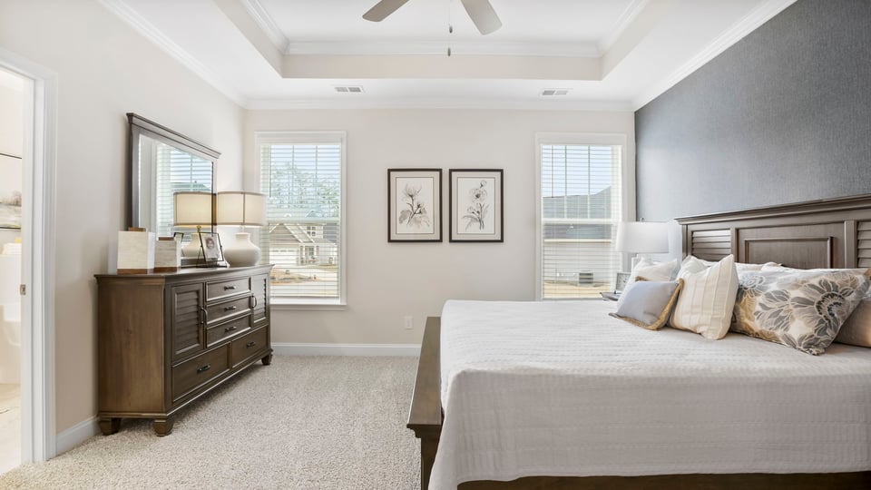Bedroom with carpet and window.