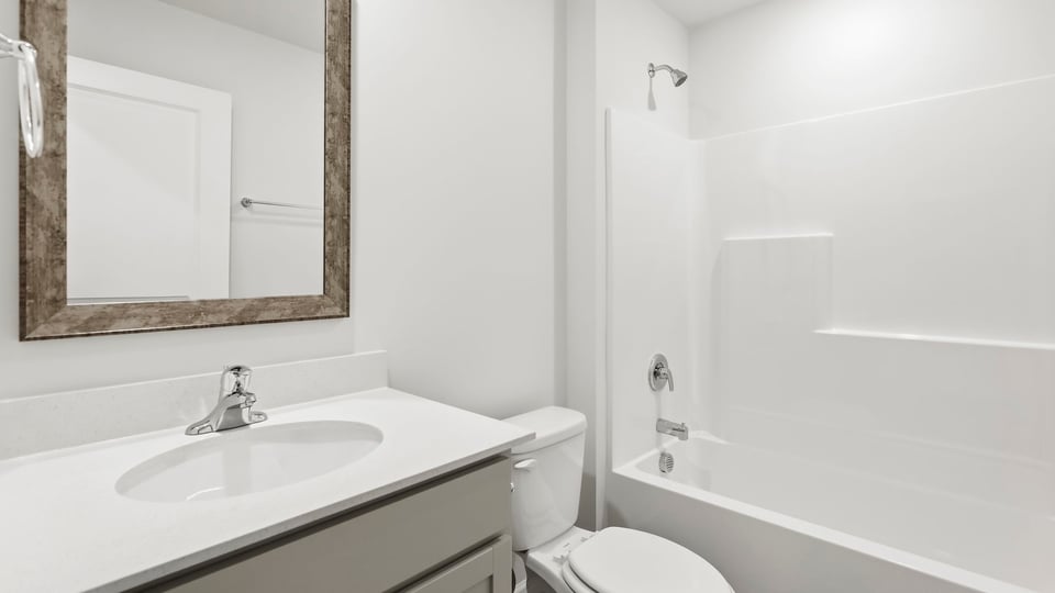 Bathroom with vanity sinks.