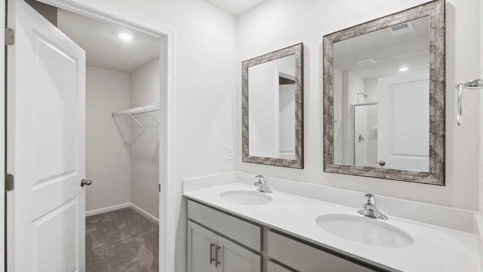 Primary bathroom with double vanity sinks.