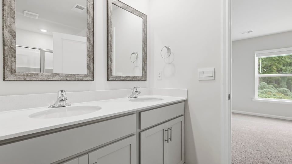 Primary bathroom with double vanity sinks.