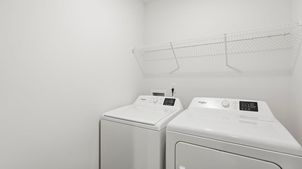 Laundry room with shelf.