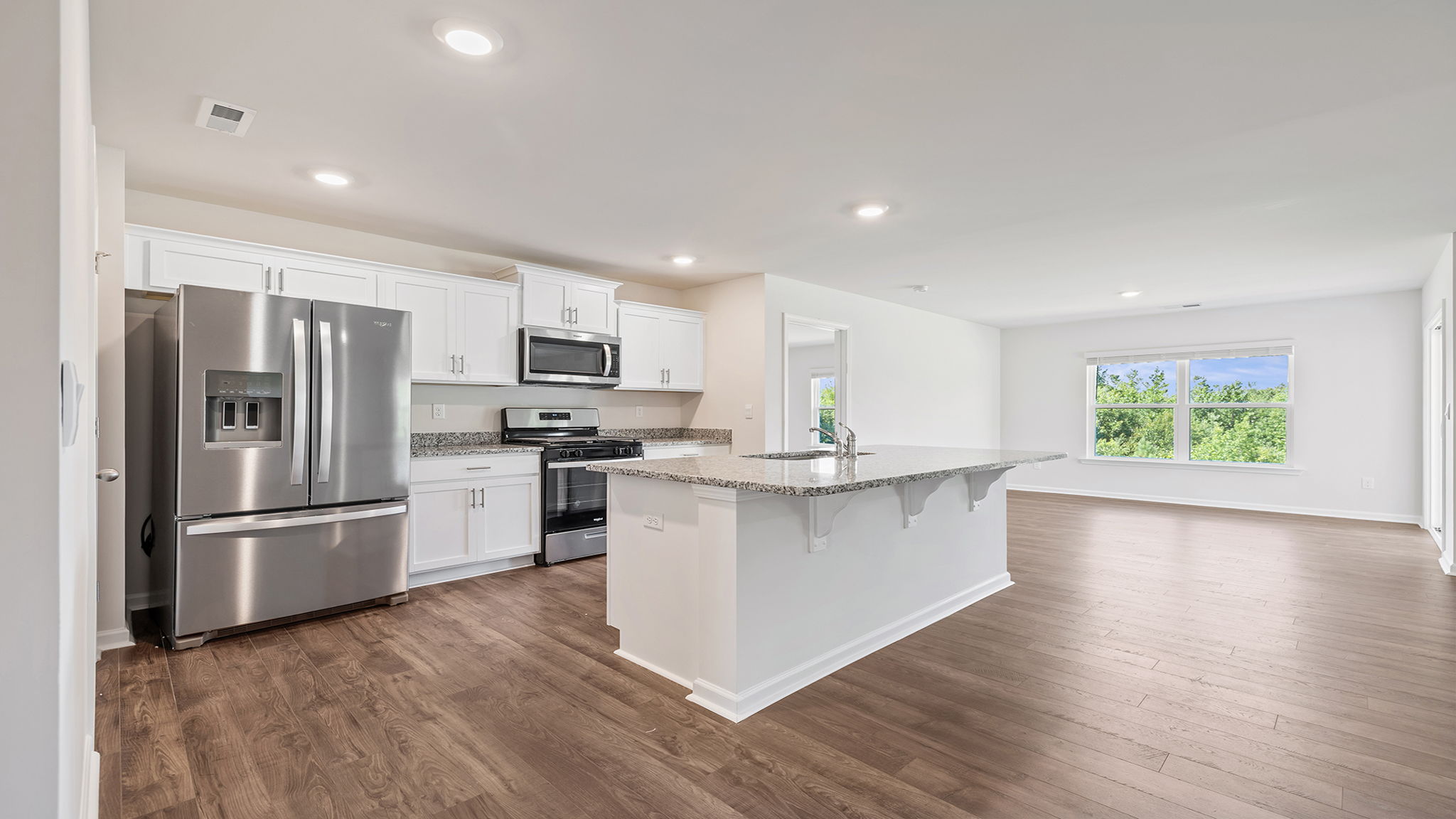 Kitchen with island and countertops.