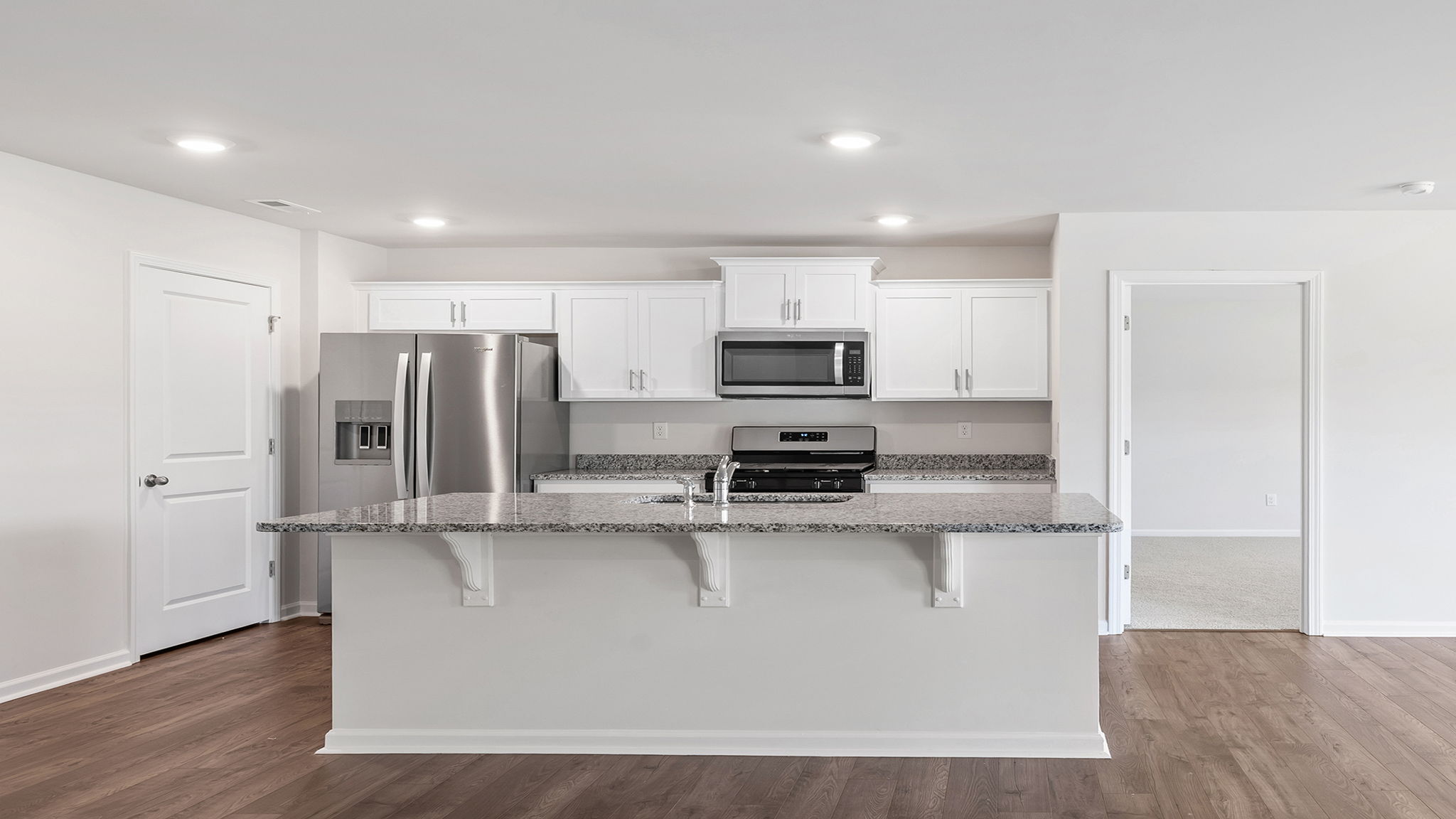 Kitchen with island and countertops.