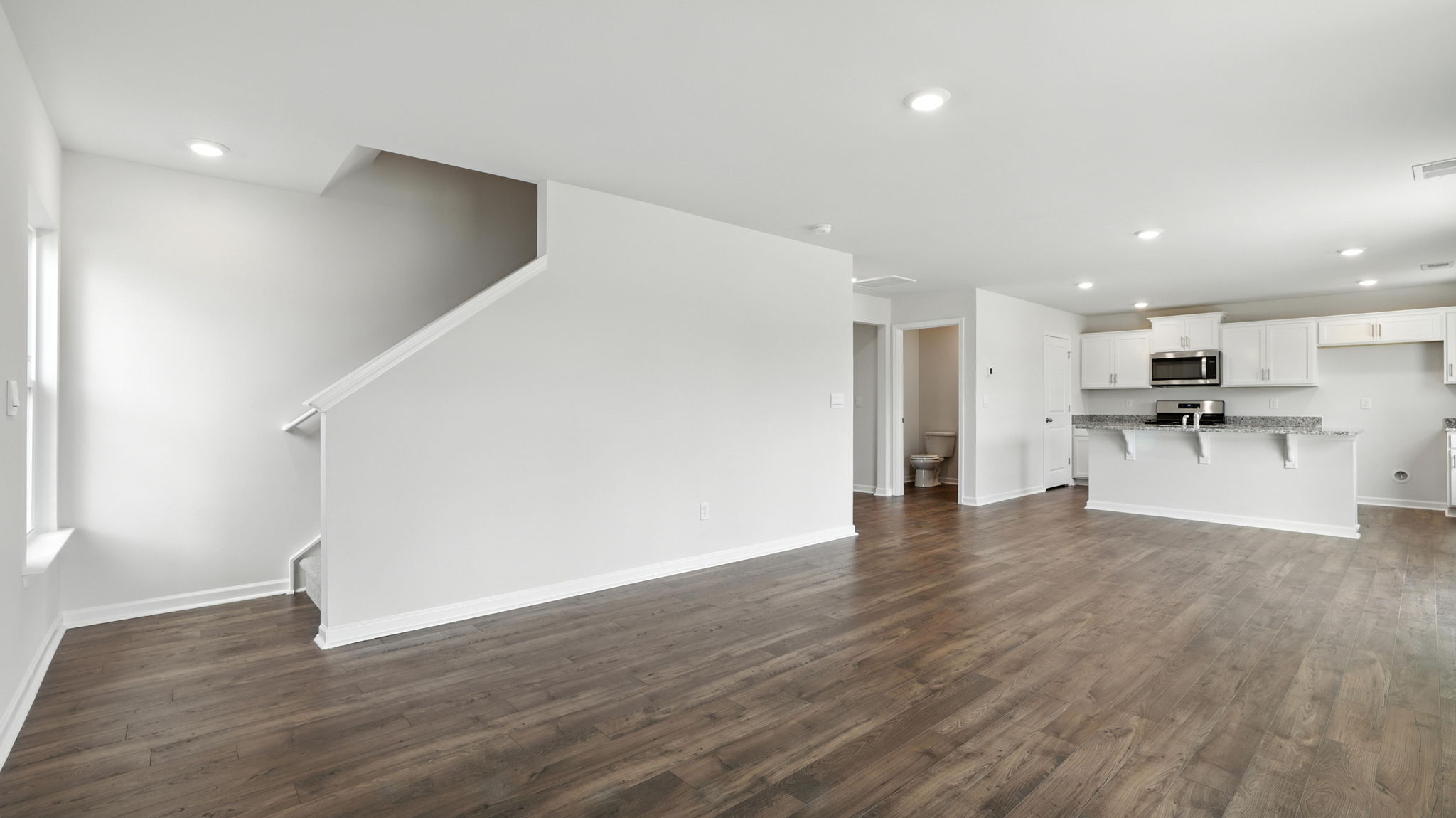 Great room with stairs to second level.