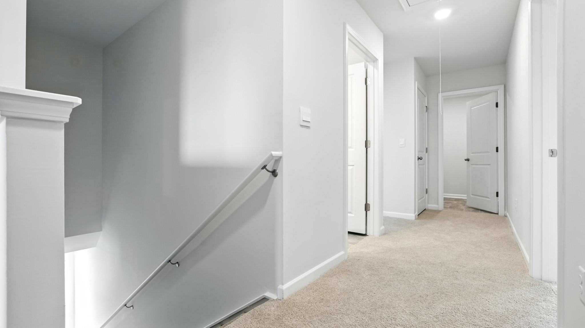 Second level landing with carpet.