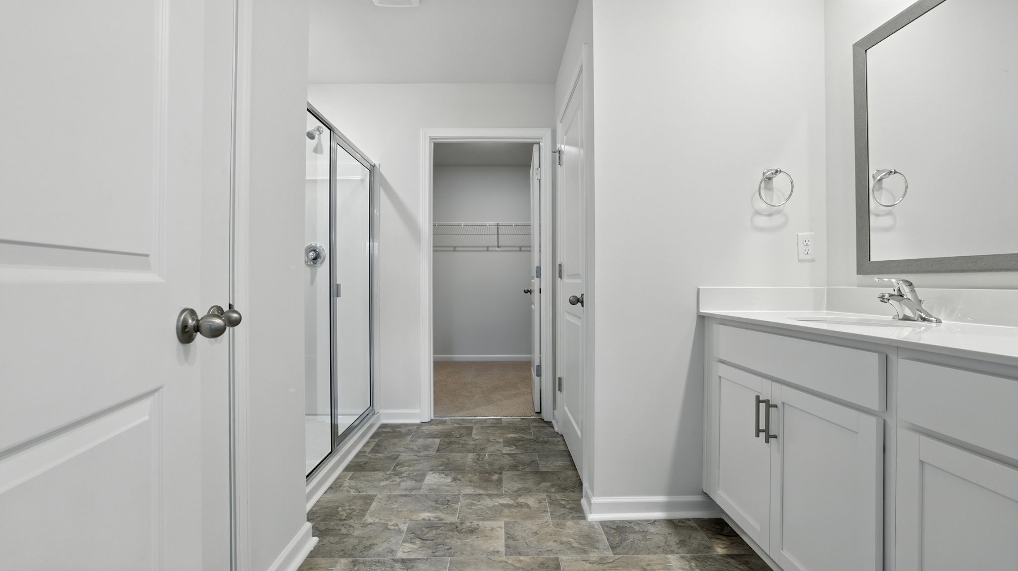 Bathroom with vanity and shower.