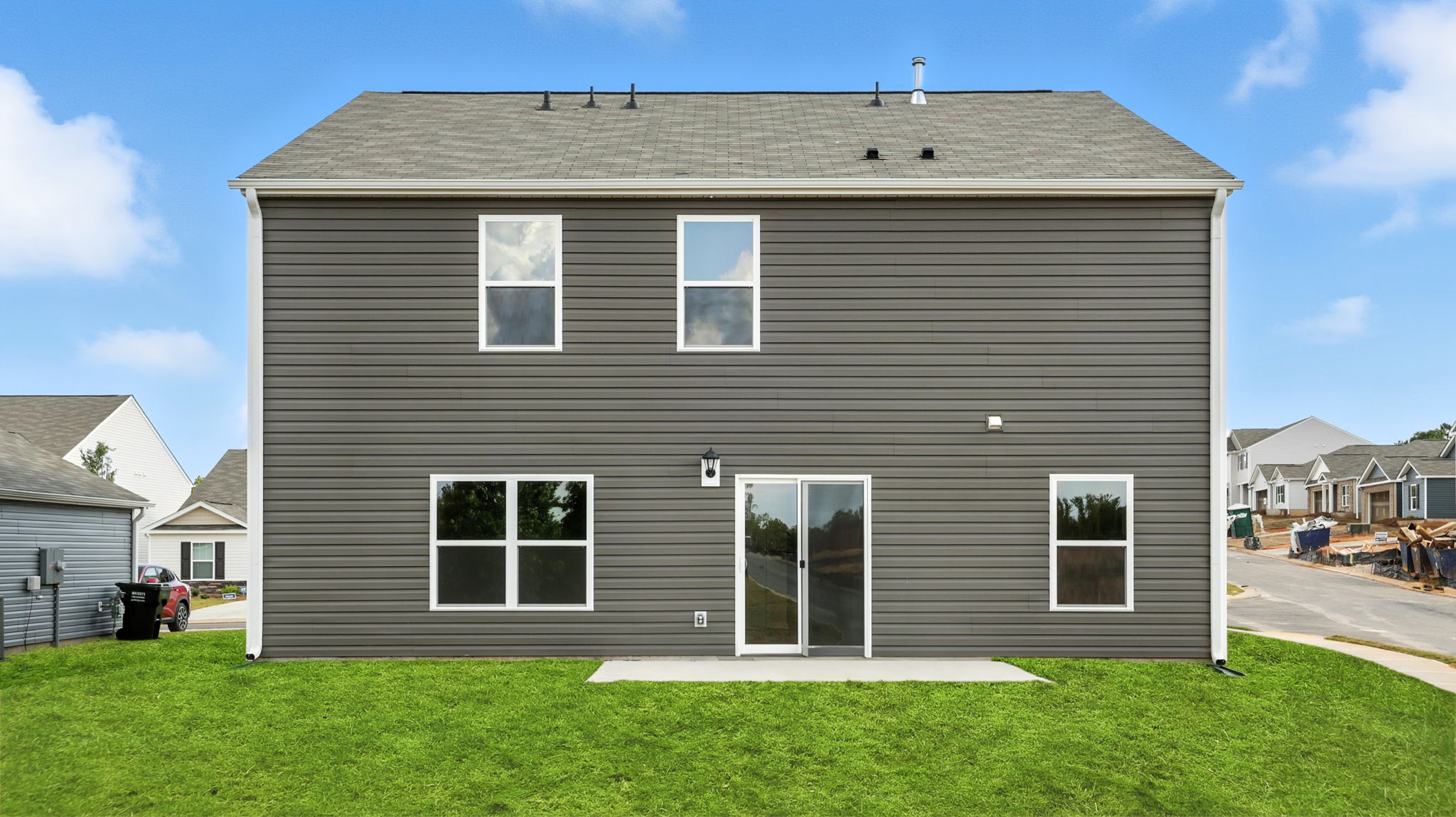 Exterior of home with large backyard.