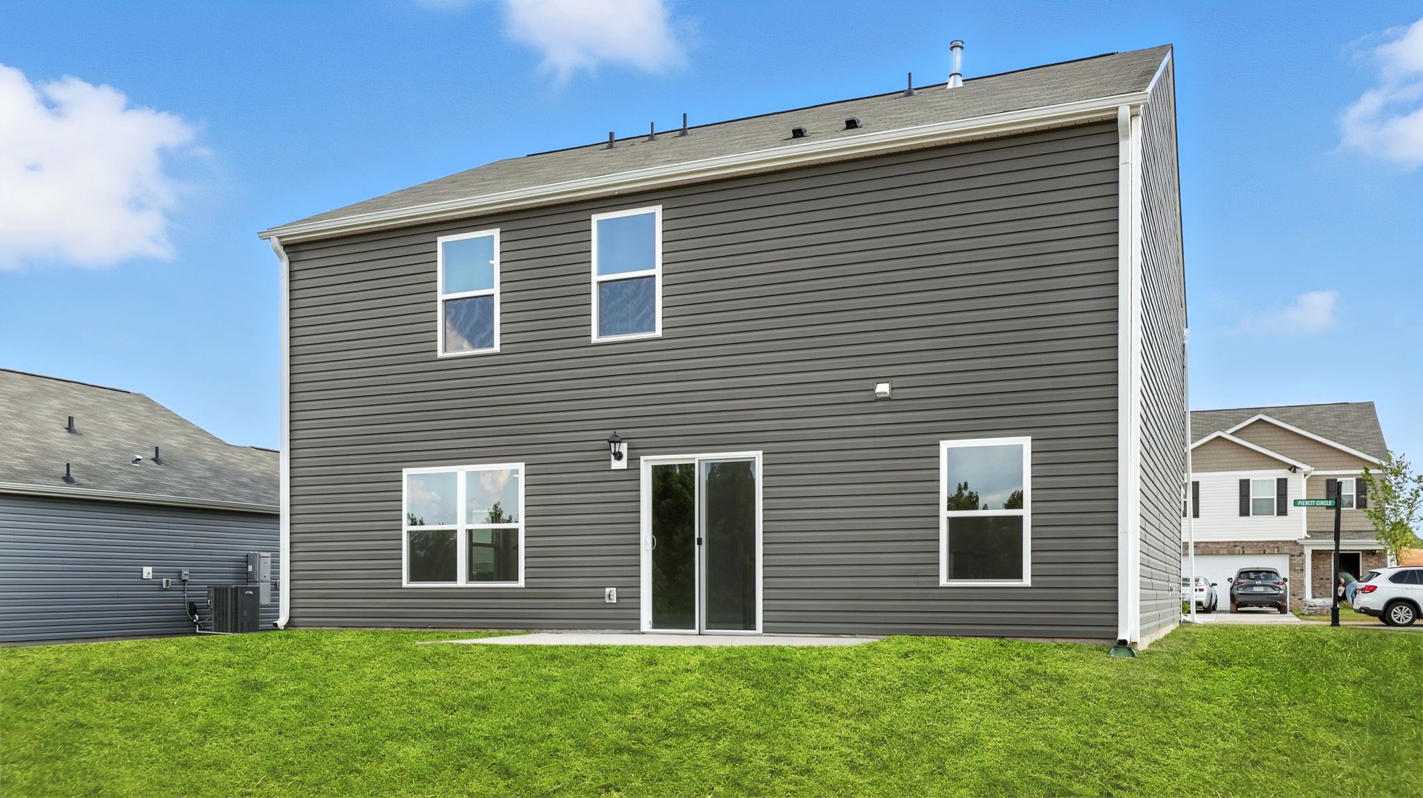 Exterior of home with large backyard.